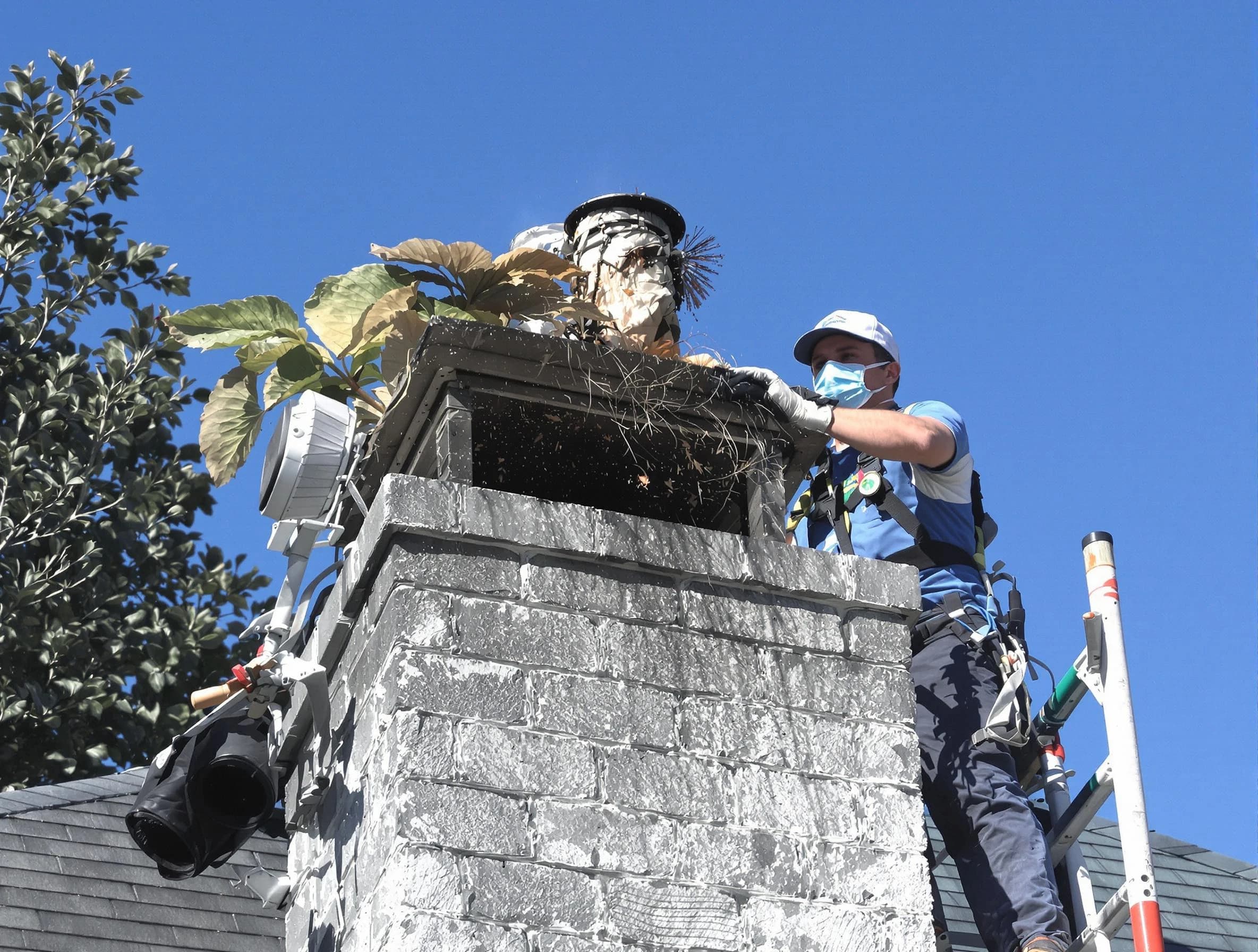 Howell Chimney Sweep specialist performing chimney cleaning in Howell, NJ